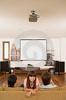 Girl and parents in living room