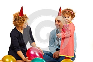 Girl with parents at party