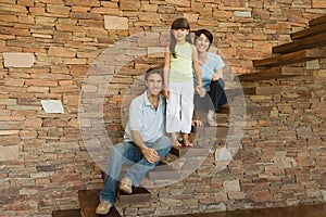 Girl and parents on stairs photo