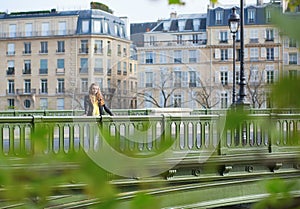 Girl in Paris on a bridge