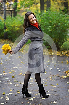 Girl in park colourful autumn
