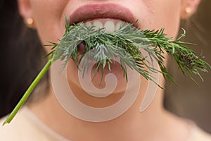 Girl with parsley in her teeth