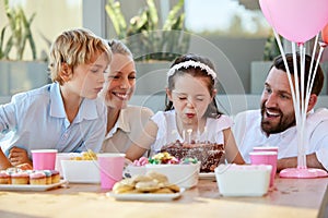 Girl, party and wow with birthday cake, happy and surprise celebration in Germany or blow candles. Child, smile and love