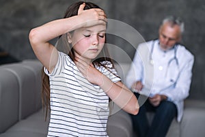 Girl patient feeling unwell, has grippe symptoms during doctor visiting at home photo