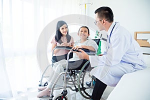 Girl patient and mother smiling while doctor visit