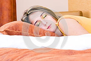 Girl peacefully sleeping in her bed photo