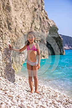 Girl on the pebble beach