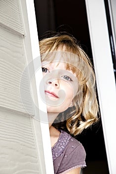 Girl Peeking Out Door