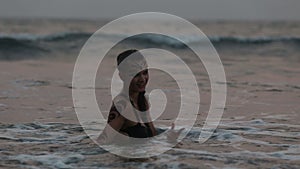 Girl Performers dance acrobatic stunts in the water