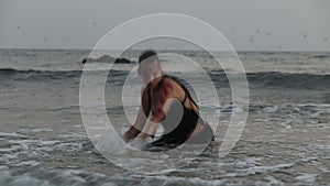 Girl Performers dance acrobatic stunts in the water