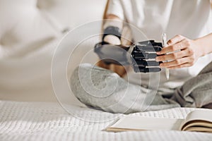 Girl performing catching activities with a prosthetic limb photo