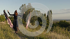 Girl performing with poi outdoors