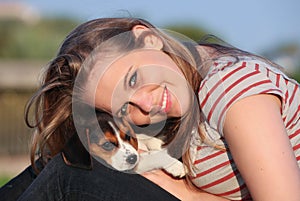 Girl with pet puppy dog