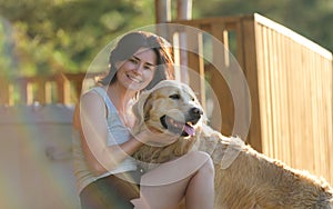 Girl Petting Golden Retriever Dog