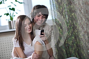 Girl with phone and boy