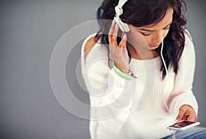 Girl, phone and search for music online with headphones for streaming, app and download podcast. Mockup, woman or relax