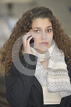 Girl phoning in train station