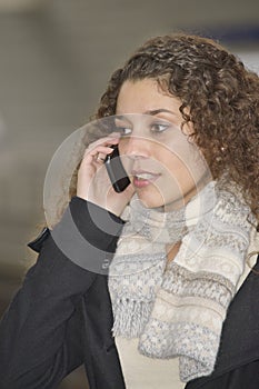 Girl phoning in train station photo