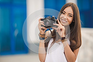 Girl photographer with professional SLR camera