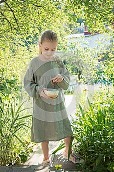 Girl picking cherries