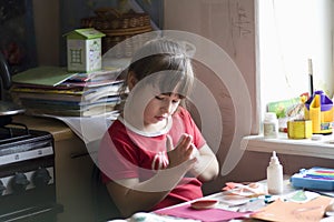 Girl Picking Glue From Her Hands