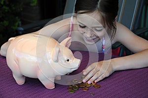 Girl with piggy bank