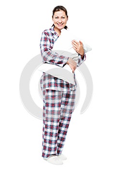 Girl with a pillow in full length on a white background