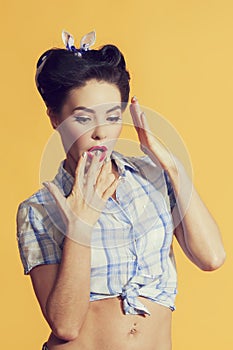 Girl in pin-up style with a brilliant manicure