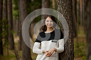 Girl in a pine forest