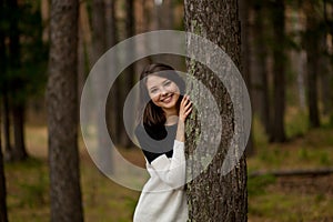 Girl in a pine forest