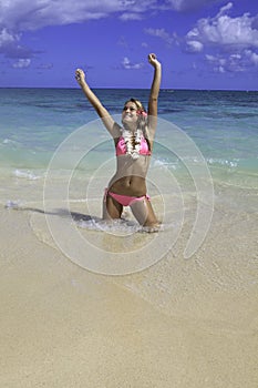 Girl in pink bikini at the beach