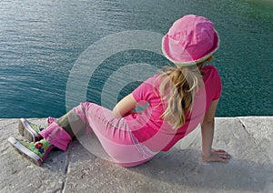 Girl with pink clothes and sea