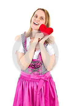 Girl in pink dirndl happy about upcoming valentines day