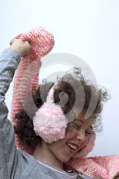 Girl with pink earmuff and pink scarf