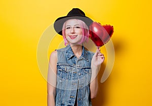 Girl with pink hair style with heart shape ballon