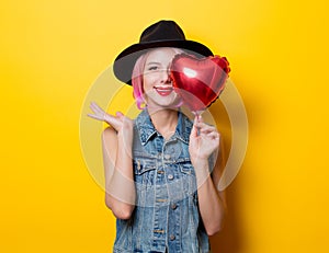 Girl with pink hair style with heart shape ballon