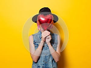 Girl with pink hair style with heart shape ballon