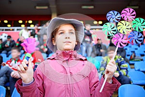 Girl in a pink jacket and panama hat with ratchet photo