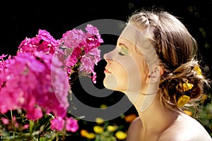 Girl and pink phlox flowers