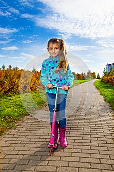 Girl with pink scooter