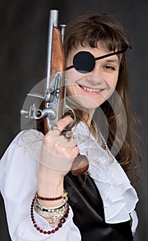 Girl - pirate with pistol in hand and eye patch