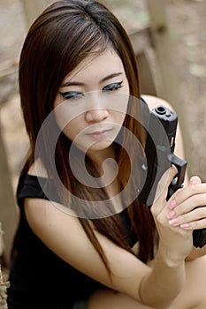 girl with pistol