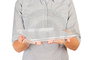 Girl in the plaid shirt is holding an empty square matte plate in front of her. woman hand hold empty dish for you desing. perspec