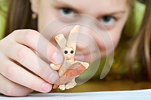 Girl with a plasticine rabbit