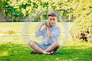 Girl play with adorable black labrador puppy