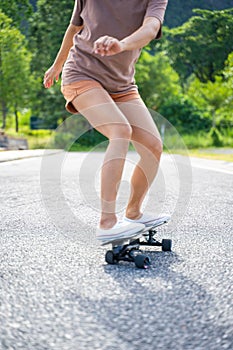 Girl play surfskate in park