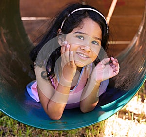 Girl, playground and wave with fun, youth and child outdoor in a park with greeting. Kid, smile and happy on school