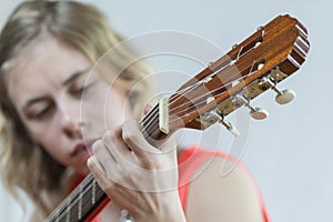 Girl playing acoustic guitar