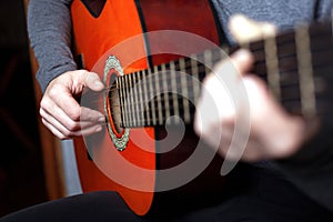 Girl playing an acoustic guitar. string musical instrument guitar
