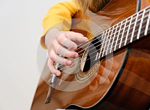 Girl playing acustic guitar